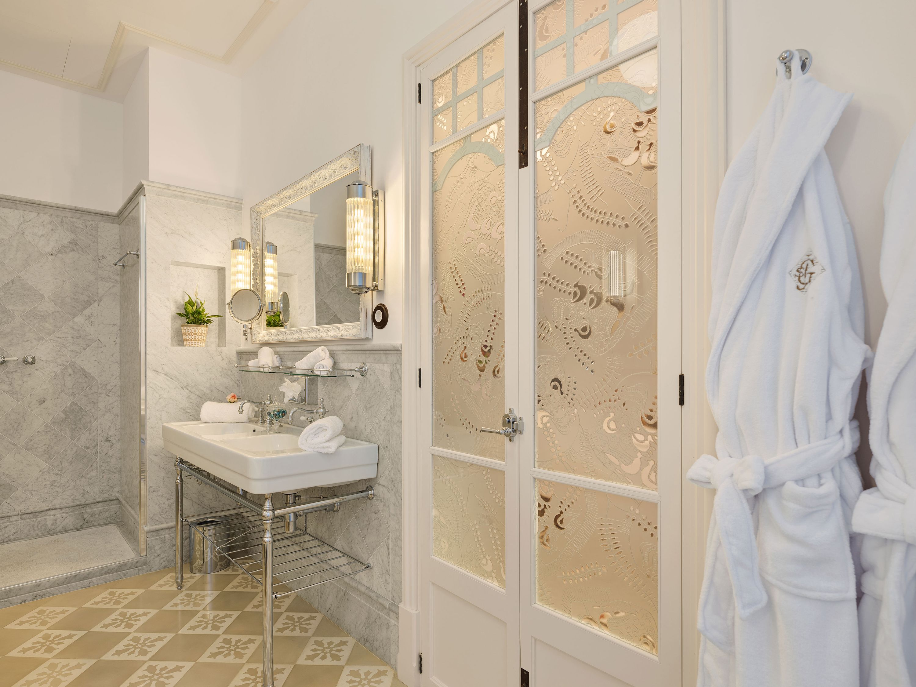 junior suite superior room with spa access | bathroom | free toiletries, hair dryer, bathrobes, slippers