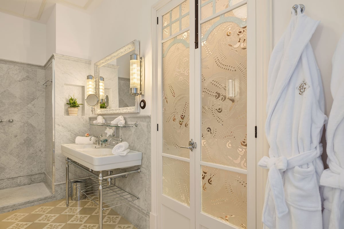 junior suite superior room with spa access | bathroom | free toiletries, hair dryer, bathrobes, slippers