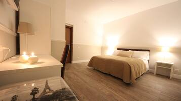 Frette Italian sheets, down comforters, memory foam beds, desk