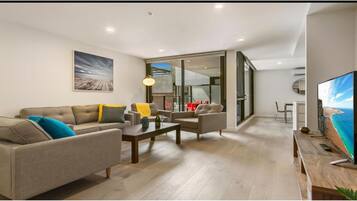 Executive 3 Bedroom Apartment | Living area | Flat-screen TV