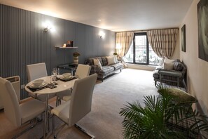 Apartment, 1 Bedroom | Living area | TV, DVD player