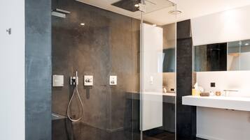 Deluxe Suite, 1 King Bed, Garden View | Bathroom | Designer toiletries, hair dryer, bathrobes, slippers