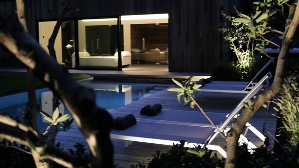 A modern house with a glass door leading to a bedroom. - B&B For 2 - Wellness For 2 (Bruges)