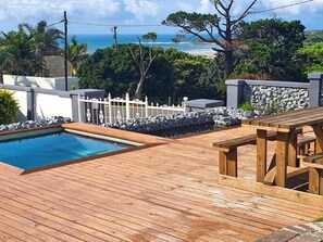 Relax on the ocean-view deck with a small pool and a bench for taking in the view.