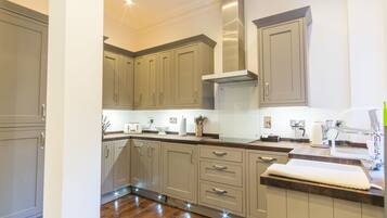 Deluxe Apartment, 2 Bedrooms | Private kitchen | Full-sized fridge, microwave, oven, stovetop