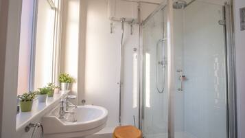 Deluxe Apartment, 2 Bedrooms | Bathroom | Separate bathtub and shower, free toiletries, hair dryer, towels