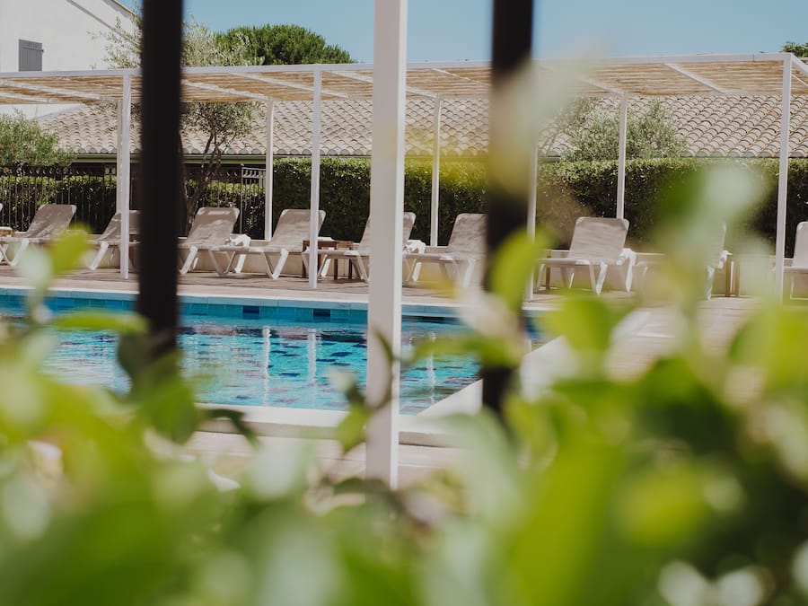 Outdoor pool, open 8 AM to 8 PM, pool umbrellas, pool loungers