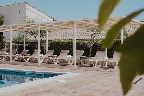 Outdoor pool, open 8 AM to 8 PM, pool umbrellas, sun loungers