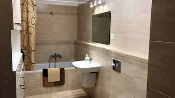 Panoramic Apartment, 1 Bedroom, Balcony, Beachfront | Bathroom | Bathtub, free toiletries, hair dryer, towels