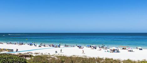 On the beach, sun loungers, beach towels