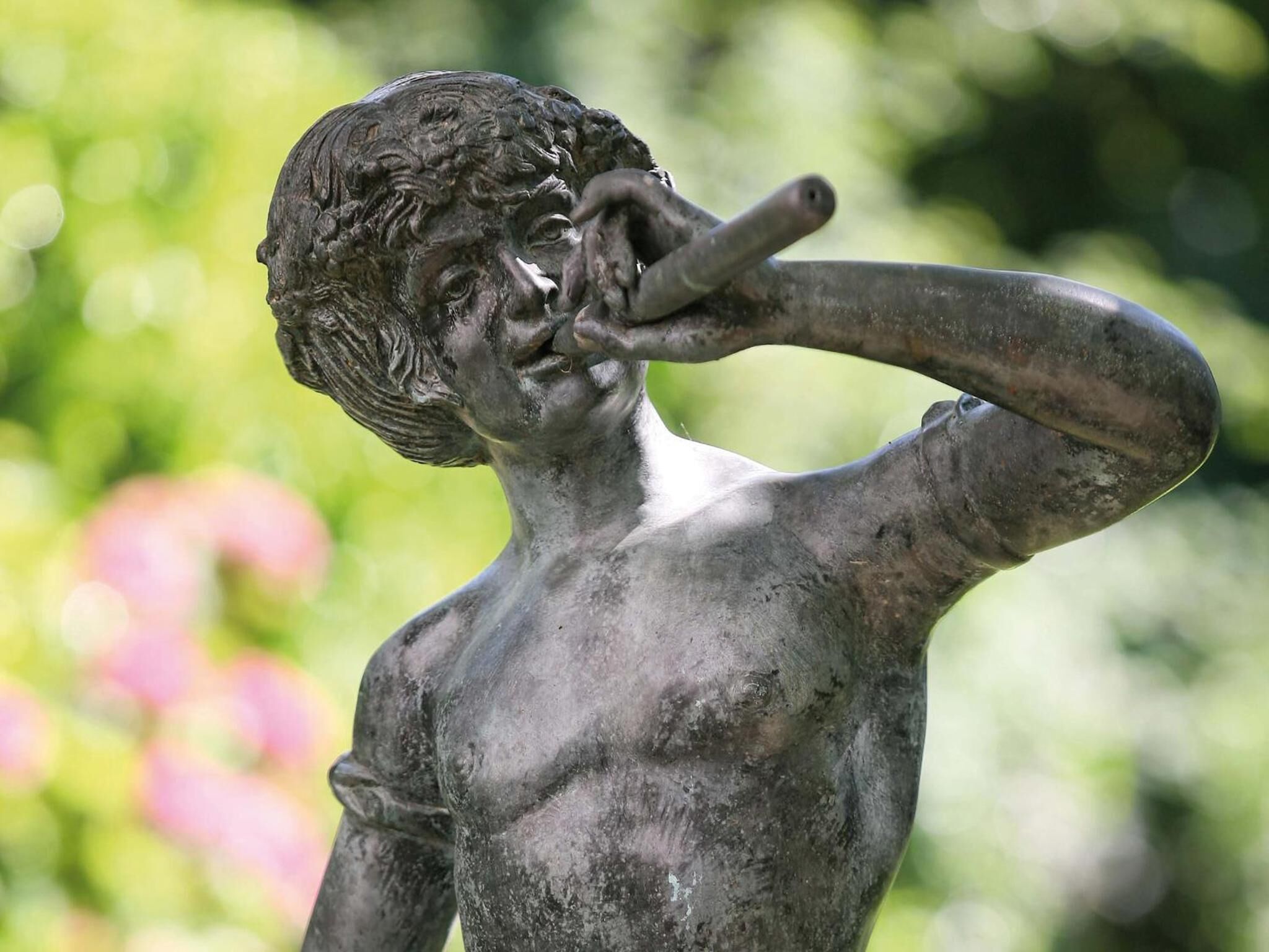 A statue of a man with a trumpet.