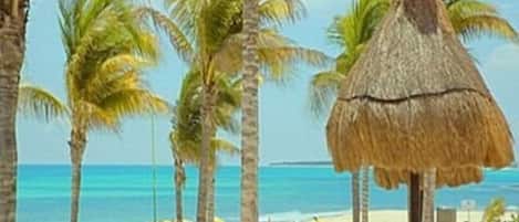 On the beach, sun loungers, beach towels