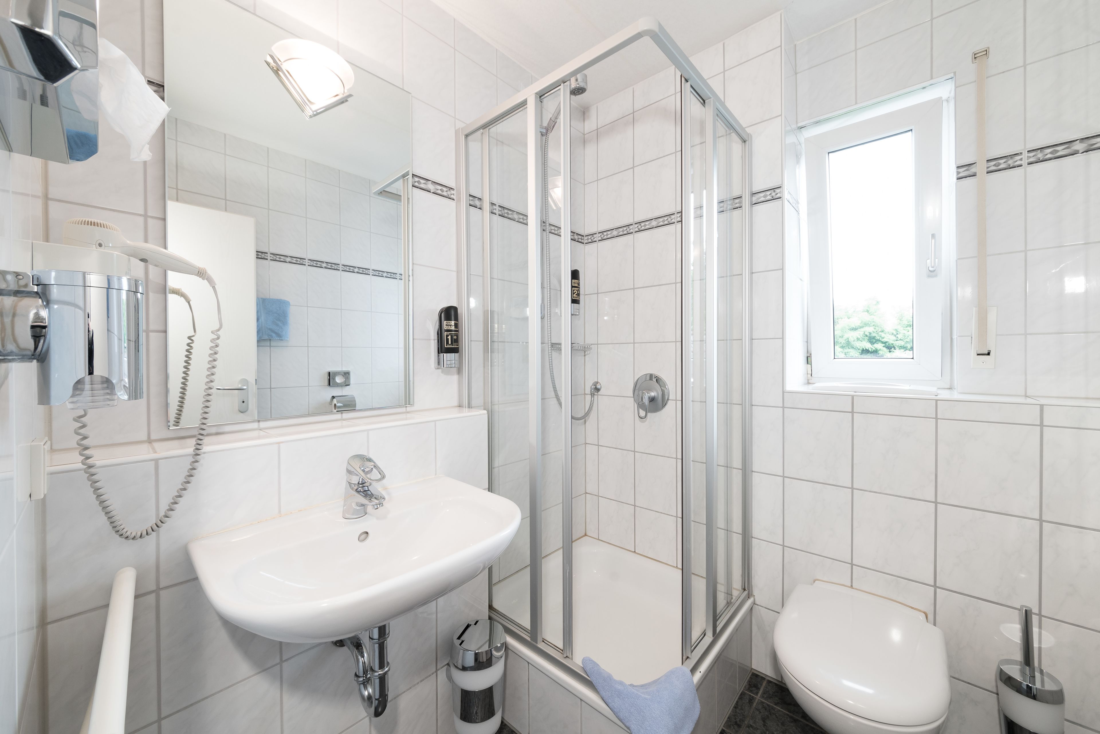 comfort double room | bathroom | shower, free toiletries, hair dryer, towels