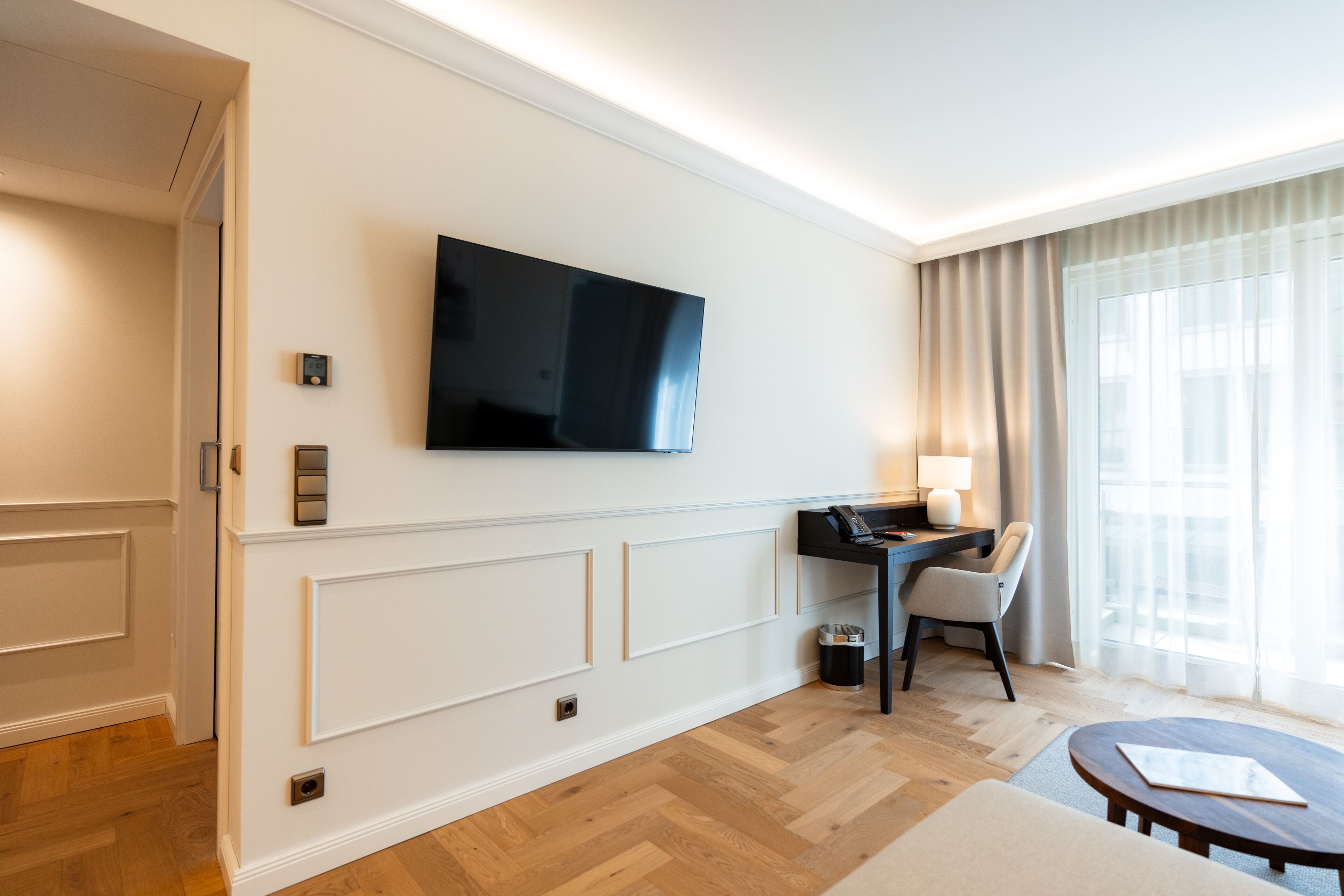 junior suite | living area | tv, heated floors