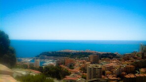 A coastal cityscape with a marina, buildings, and a clear view of the sea. - monaco holiday house blue coast montecarlo (Beausoleil)