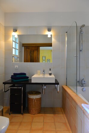 Combined shower/tub, hair dryer, towels, toilet paper