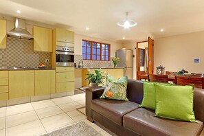 Angel Cottage | Living area | TV, DVD player - Angel Cottage (Cape Town)