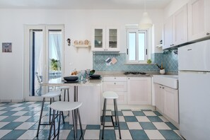 Fridge, stovetop, coffee/tea maker, cookware/dishes/utensils