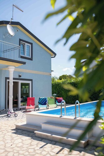 Holiday home with pool and barbecue