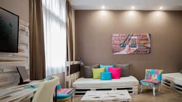 Deluxe Quadruple Room | Premium bedding, in-room safe, desk, iron/ironing board