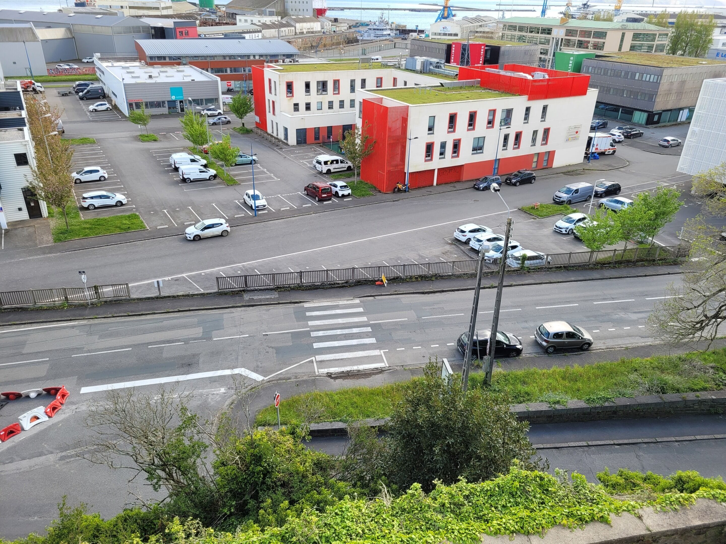 A multi-story parking garage with several levels and a covered walkway.
