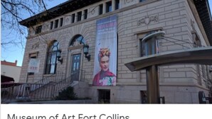 A building with a large banner and a staircase leading to the entrance. - Front Porch, Sunny Coffee Nook, Gorgeous Bathroom, One block to CSU & Old Town! (Fort Collins)