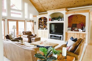 Smart TV, fireplace, books, printers