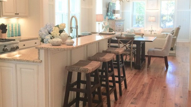 A spacious kitchen with a central island, wooden bar stools, and pendant lighting. - "The Lighthouse" in WaterColor. Pool, Walk to beach, 4 Bikes & WC amenities incl (Santa Rosa Beach)