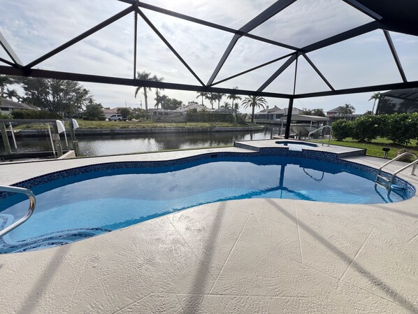 Outdoor pool, a heated pool - Southern Exposure, Gulf Access, Heated Pool Home with a Hot Tub and Large Lanai! (Cape Coral)