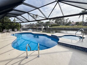 Outdoor pool, a heated pool - Southern Exposure, Gulf Access, Heated Pool Home with a Hot Tub and Large Lanai! (Cape Coral)