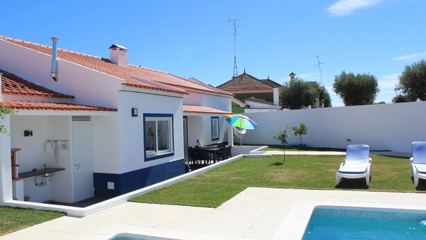 A residential property with a swimming pool, a covered outdoor seating area, and a small garden. - Villa Terena with private pool (Terena)