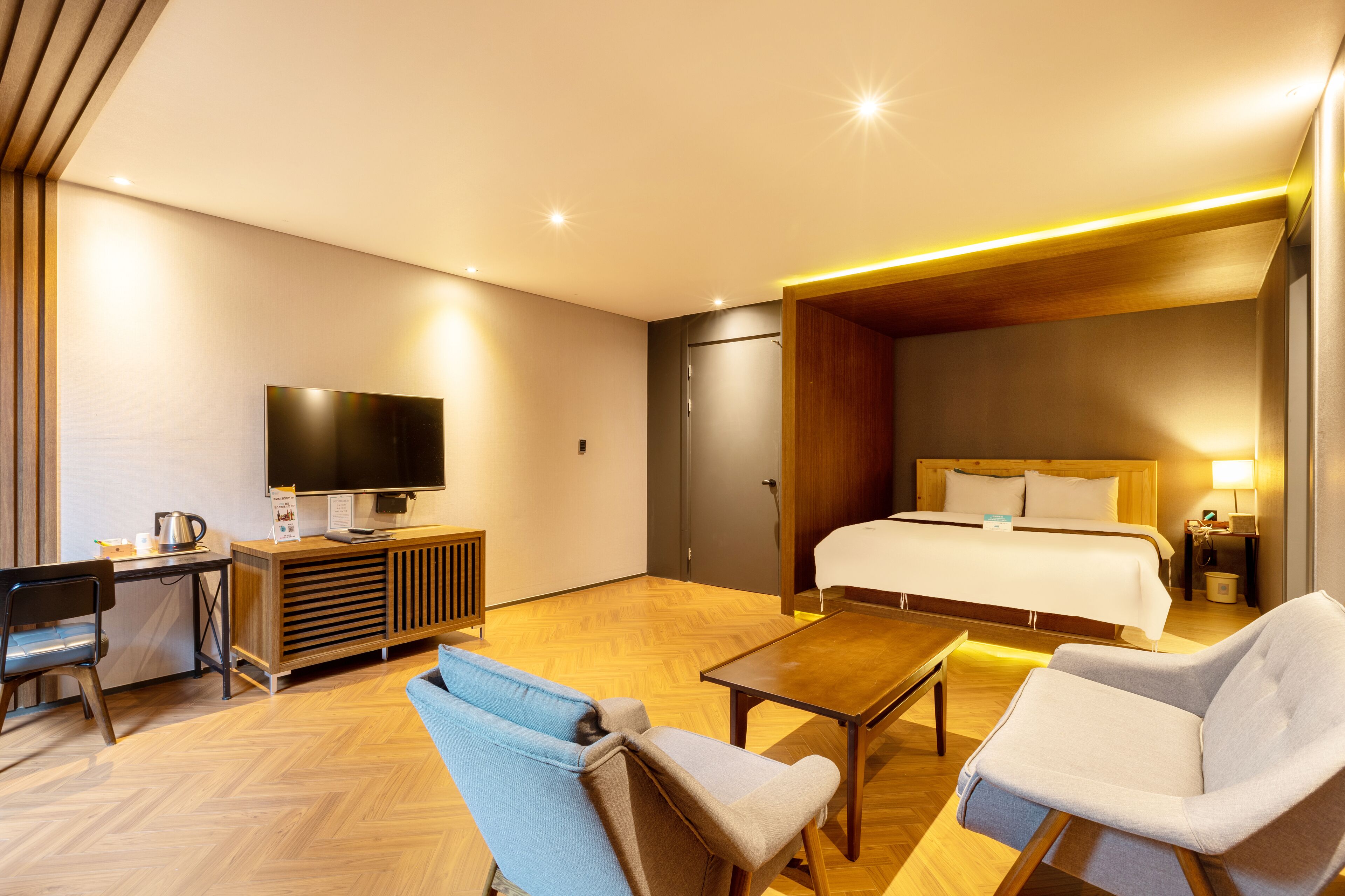 Suite, 1 King Bed | Living area | 43-inch flat-screen TV with digital channels, TV, heated floors