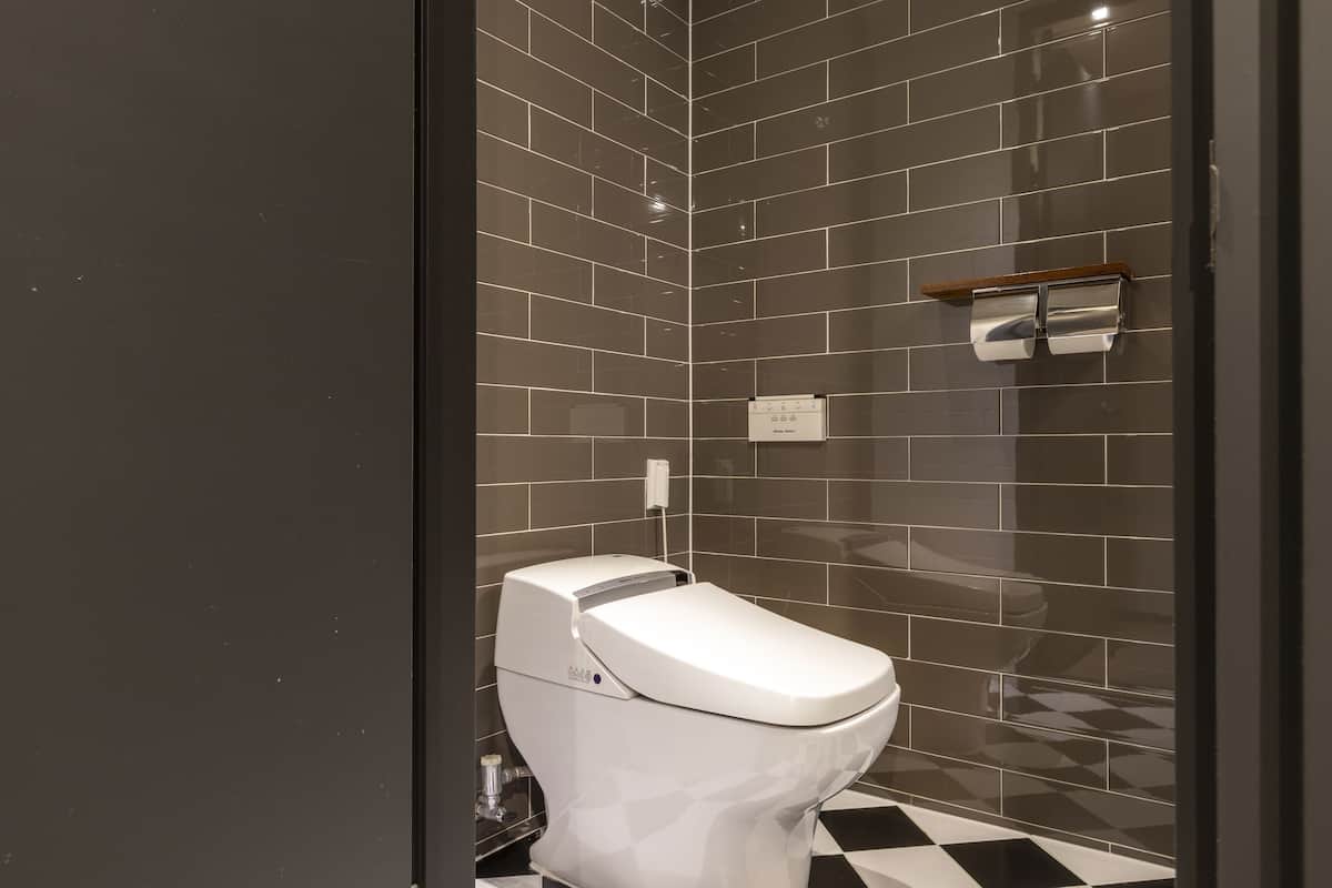 suite, 1 king bed | bathroom | shower, rainfall showerhead, designer toiletries, hair dryer