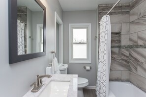 Combined shower/tub, hair dryer, towels, soap