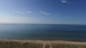 On the beach, sun-loungers, beach towels