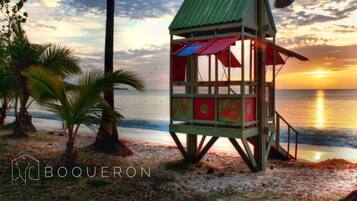 Situated on the beach, this lifeguard tower offers a vantage point for beachgoers and safety personnel.