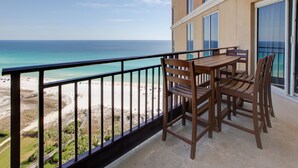A balcony with a view of the beach and ocean. - Golf Cart ~ Spacious Living Area ~ Private Balcony (Miramar Beach)