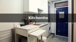 A compact kitchen with a built-in washing machine, a sink, and a countertop with a kettle. - Ur Seoul Home (Seoul)