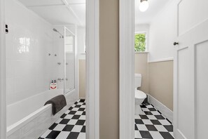 Combined shower/bathtub, hair dryer, towels, soap - Stylish 1 Bedroom Apartment ~ New Farm (New Farm)