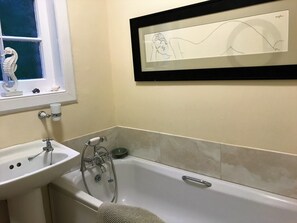 Combined shower/bathtub, hair dryer, bathrobes, towels