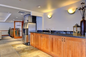Enjoy cooking in this well-equipped kitchen with a refrigerator, oven, and sink.