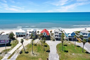 A coastal residential area with houses, a beach, and a clear sky. - Gulf Front, North Cape San Blas, Pet Friendly - Sun Chaser (Cape San Blas)