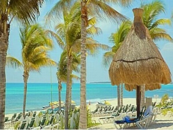 On the beach, sun loungers, beach towels