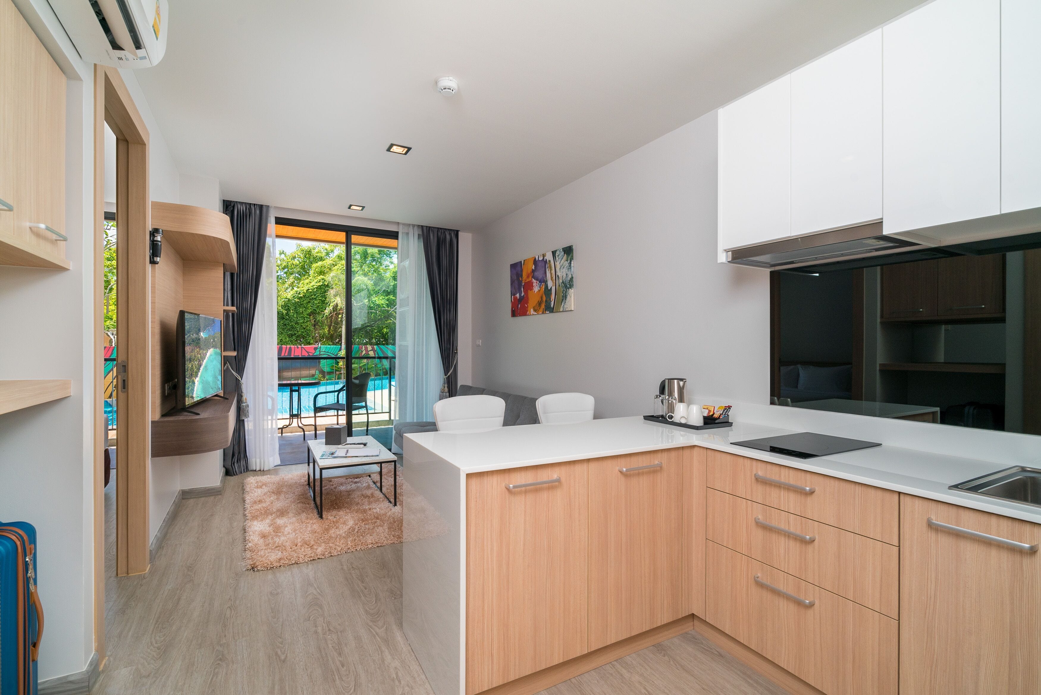 one bedroom deluxe pool side | living area | 40-inch led tv with satellite channels, tv