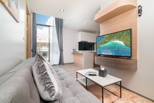 Three Bedroom Duplex | Living room | 40-inch LED TV with satellite channels, TV