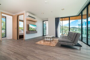 Four Bedroom Penthouse | Living room | 40-inch LED TV with satellite channels, TV