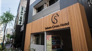 A building with a sign for Sakura Cross Hotel.