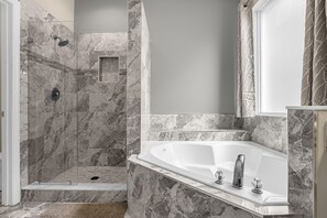 Combined shower/tub, hair dryer, towels, soap