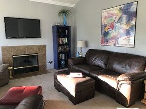 Smart TV, fireplace, DVD player, books
