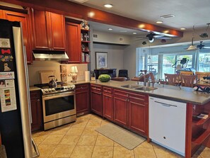 Fridge, microwave, oven, stovetop - Waterfront Luxury Oasis - Steps to Beach     
 - Kayaks, Private Dock & Patio 🏖 (Indian Rocks Beach)